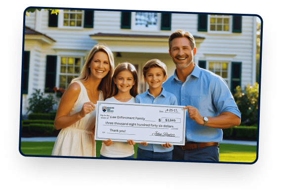 A family receiving a ceremonial check in front of their home